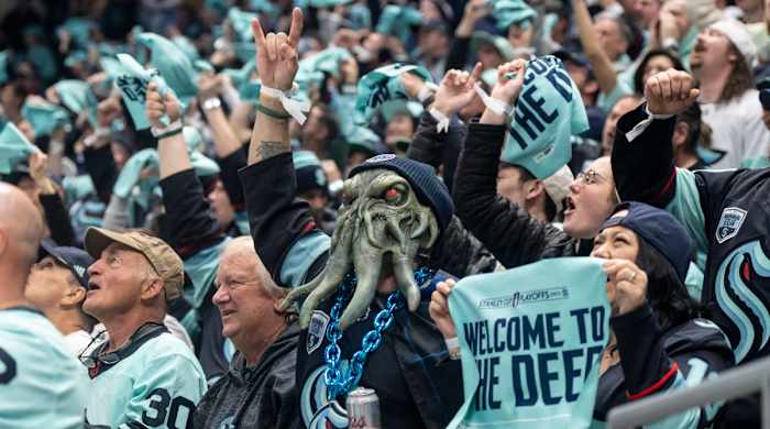 Fans celebrate a Seattle Kraken goal during game three of the second round of the 2023 Stanley Cup Playoffs.